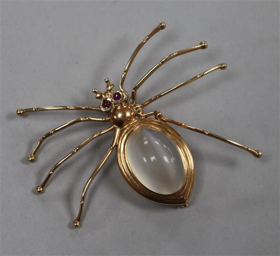 A 14ct gold and gem set spider brooch with chatoyant cabochon quartz body, width 52mm.